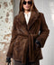 Brown Short mink fur coat featuring a belted design and luxurious texture, perfect for cold-weather elegance.